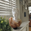 Decorative marble bust of a woman with a laurel wreath