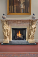 Fireplace mantel with female statues made of marble