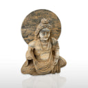 Stone statue of weathered Maitreya in Black Limestone
