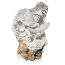 Half raw stone statue of child holding a koi fish
