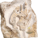 Abstract-style marble relief of Guanyin (or Buddha), carved in raw stone with antique grotto inspiration.