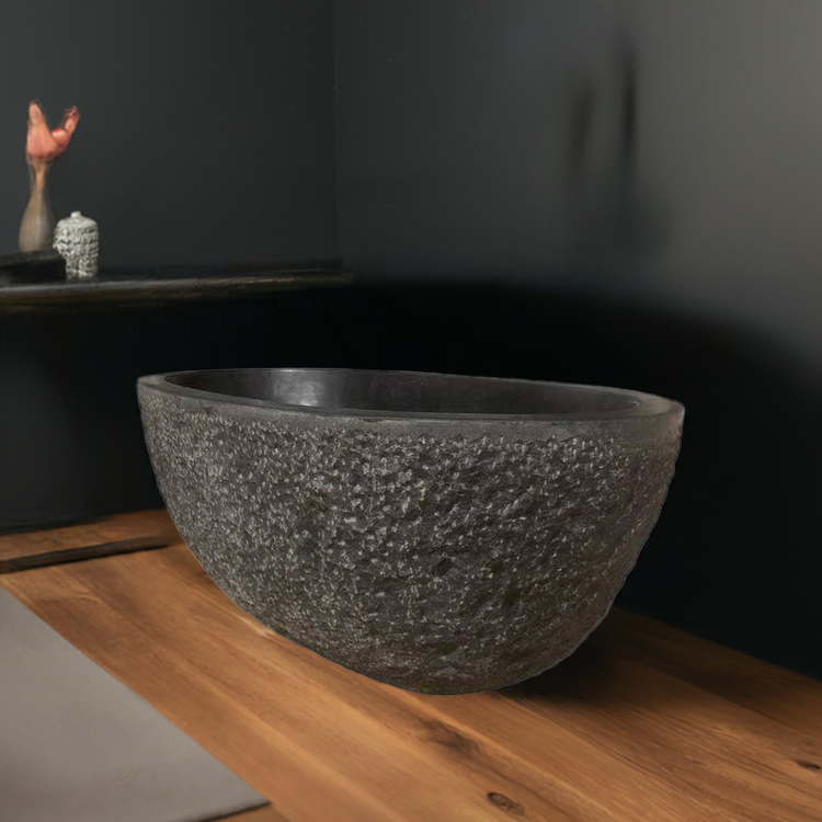 Granite bathtub polished interiors and rims with a chiseled exterior