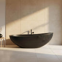 Large Stone Bathtub and Matching Black Marble Basins for Master Bathroom
