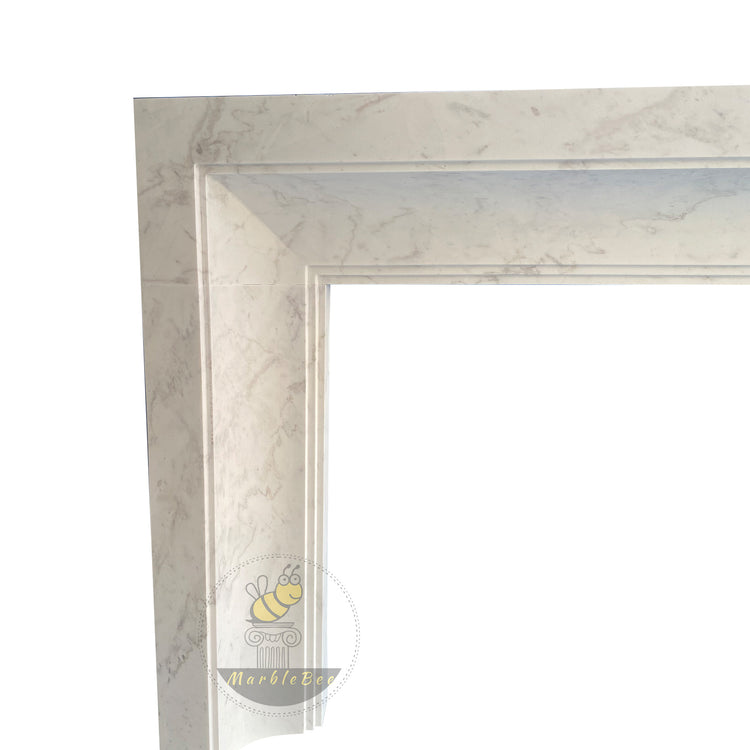 White stone fireplace Bolection