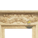Beige Fireplace Surround with Angel Carvings and Statues on Pedestals