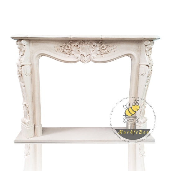 Marble fireplace mantel with conch carving