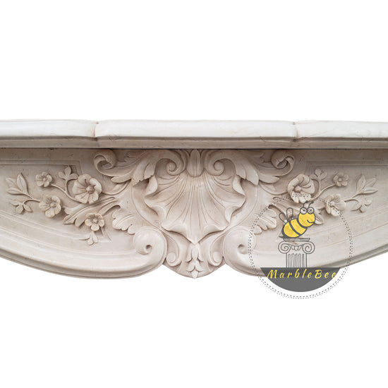 Marble fireplace mantel with conch carving