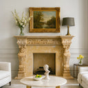 Marble fireplace mantel with sculptures