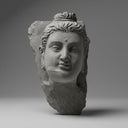 Stone statue of meditative Buddha head