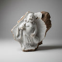 Emerging stone sculpture of Buddha