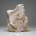 Abstract-style marble relief of Guanyin (or Buddha), carved in raw stone with antique grotto inspiration.
