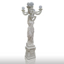 White marble statue of women holding marble lamp