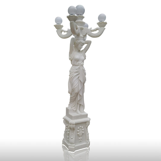 White marble statue of women holding marble lamp