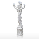 White marble statue of women holding marble lamp
