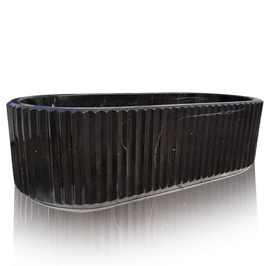 marble bathtub hand-carved from black marble with fluted pattern