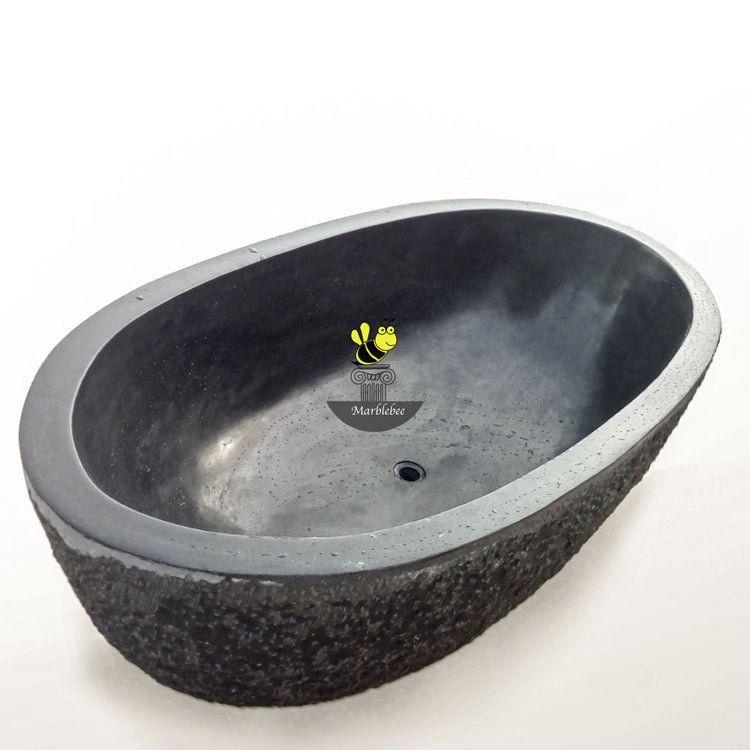 Granite bathtub polished interiors and rims with a chiseled exterior