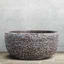 Round tub hand-carved from brown marble Japanese soaking tub style