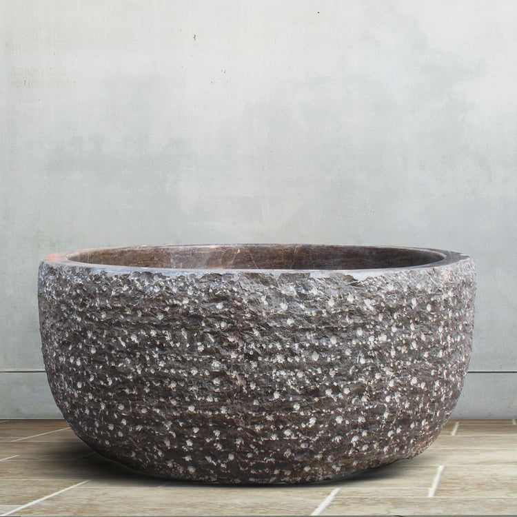 Round tub hand-carved from brown marble Japanese soaking tub style